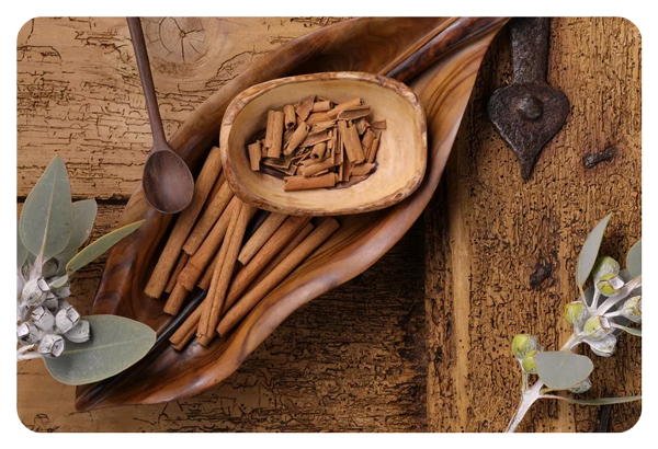 photo of cinnamon sticks in a wooden bowl taken with the canon 5d mark iv